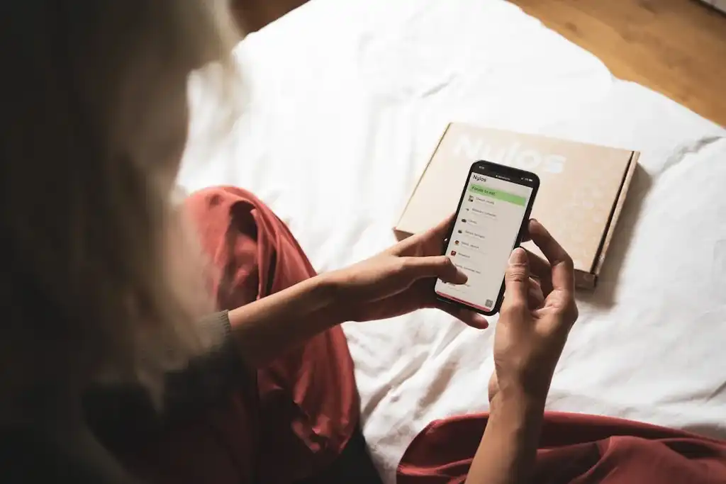 Woman on phone CureNatural app